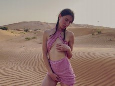 Cute brunette masturbating in the desert gif
