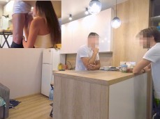 Girl sucks dick under counter while man talks to friend gif