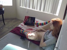 Redhead Skarlet Skies in rainbow socks gets filmed while masturbating gif