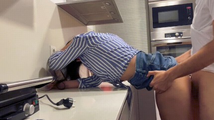 horny couple fuck in the kitchen with clothes on