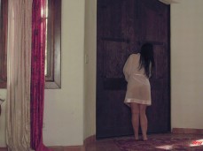 Angela White in sheer robe answers door gif