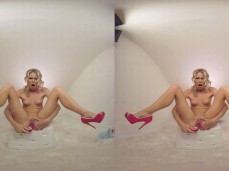 Blonde Claudia Mac in pink high heels plays with toy to orgasm gif