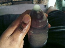 A tasty huge black cock filled a magnum condom gif
