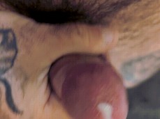 Big, hairy, tattooed guy strokes his smallish, hot cock, and cums 0105-1 10 gif