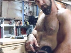 Handsome, bearded, hairy-chested, bald-headed handyman shows his tools 0011 gif
