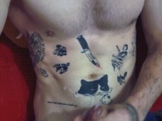 Hot-chested, inked, hung, uncut BuffaloBlll feeds the kitten on his stomach gif