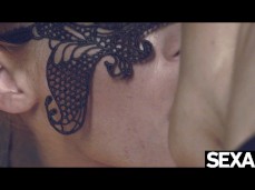 Masked lesbians kiss while fingering blindfolded girl gif