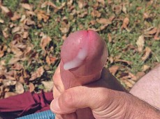 Sturdy, hairy-chested man strokes his big, thick knob outdoors; hot cumshot gif